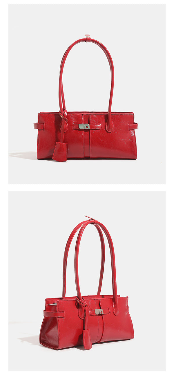 Structured glossy leather-look tote bag with long loop handles and silver turn-lock buckle closure, detail view 10