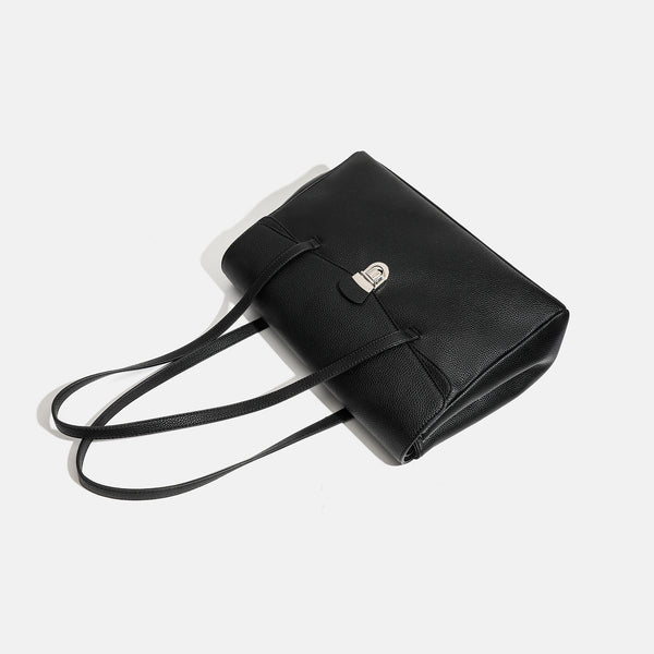 Structured black pebbled-finish flap tote bag with silver turn-lock clasp and long double shoulder straps, detail view 4