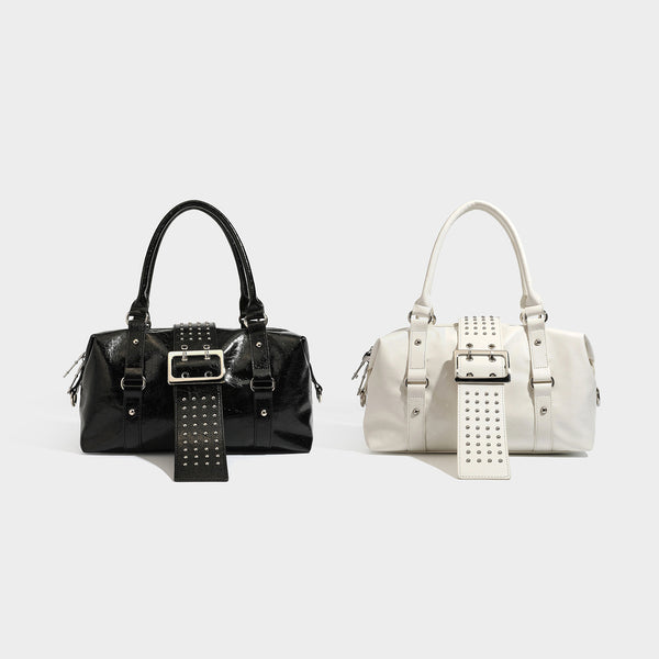 Glossy crinkled barrel handbag with silver stud buckle strap and detachable shoulder strap, detail view 2