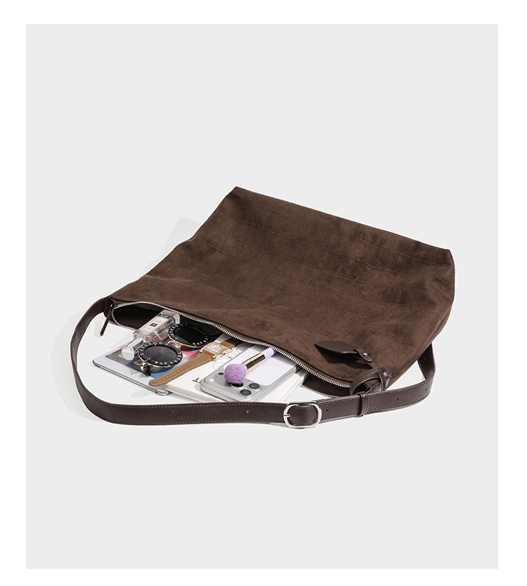 Slouchy croc-embossed matte hobo shoulder bag with adjustable strap and top zip closure, detail view 14