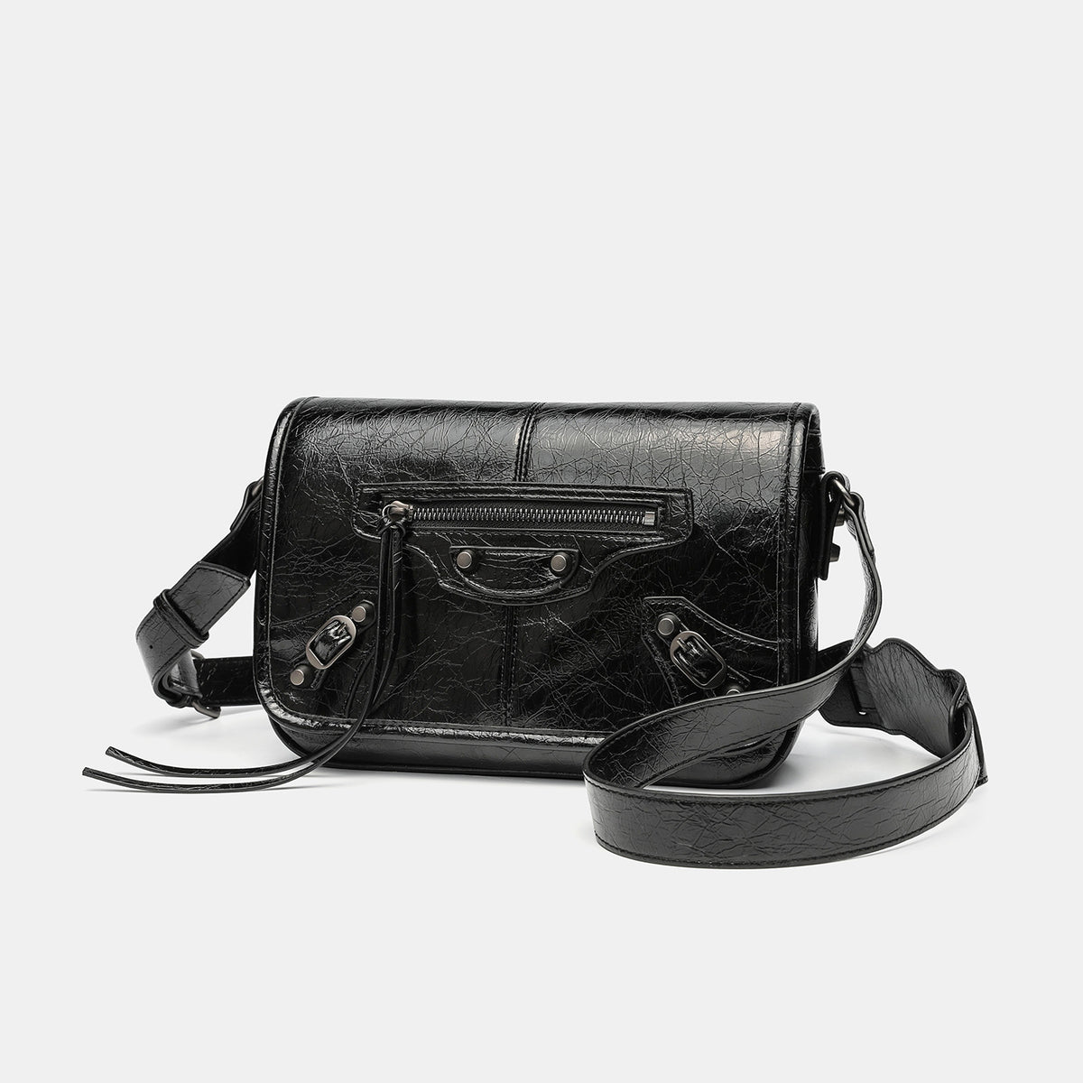 Small structured rectangular crossbody bag with crinkle leather-look finish, front zip pocket, gunmetal stud hardware, and