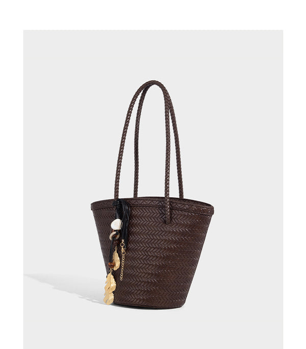 Chevron-woven bucket tote bag with braided shoulder straps and matching drawstring pouch, detail view 16