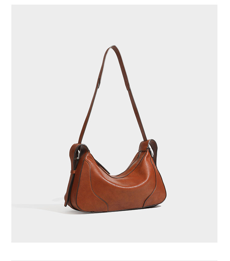 Dark brown curved zip-top hobo shoulder bag with slim adjustable strap and silver-tone hardware, detail view 19