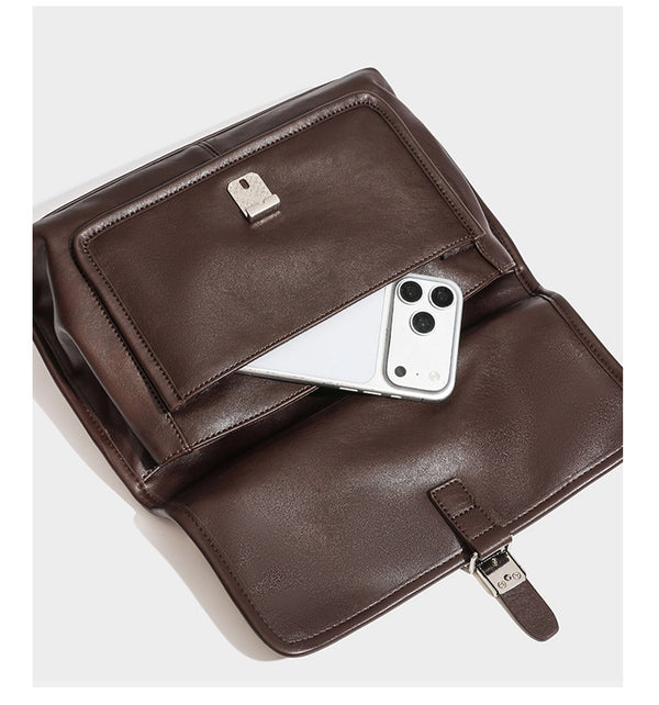 Structured rectangular flap satchel in espresso brown leather-look finish with silver-tone turn-lock buckle, top handle, and