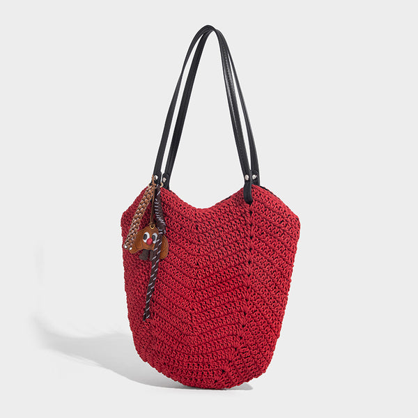 Woven crochet open-top shoulder tote bag with slim brown leather-look straps and braided charm accent, detail view 6
