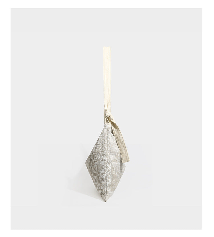 Weich fallende Hobo-Schultertasche aus Canvas mit botanischem Print, langem geknotetem Riemen und Reißverschluss oben, Detailansicht 9