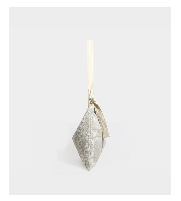 Weich fallende Hobo-Schultertasche aus Canvas mit botanischem Print, langem geknotetem Riemen und Reißverschluss oben, Detailansicht 9