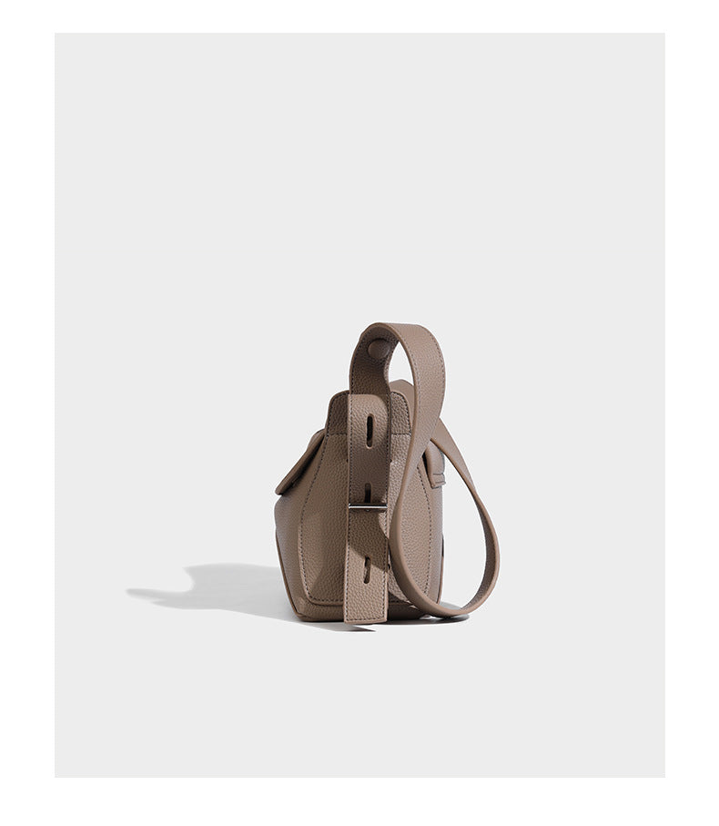 Structured curved-flap pebbled PU shoulder bag with sculptural loop strap detail, detail view 13