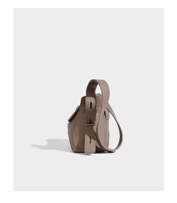 Structured curved-flap pebbled PU shoulder bag with sculptural loop strap detail, detail view 13