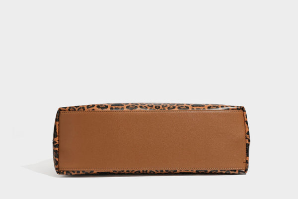 Glossy leopard-print slouchy shoulder bag with long strap and detachable tan zip pouch, detail view 30