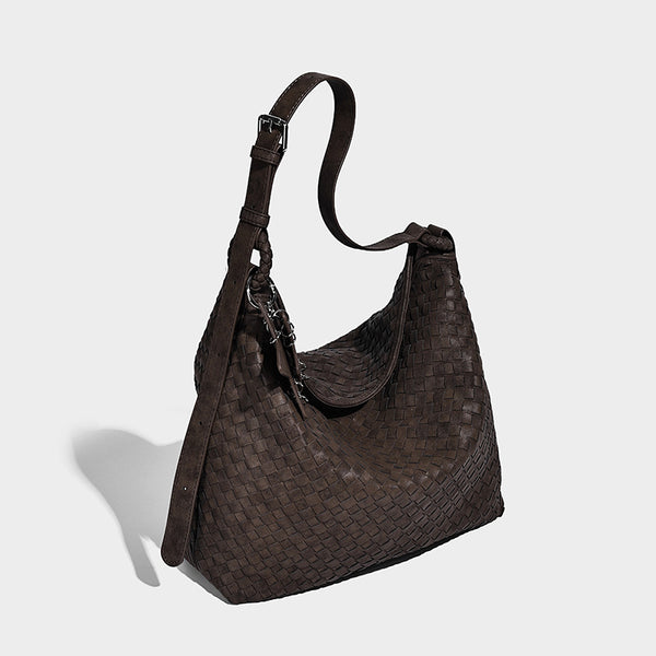 Large soft woven hobo shoulder bag with matte textured finish, adjustable strap, and star charm hardware, front view