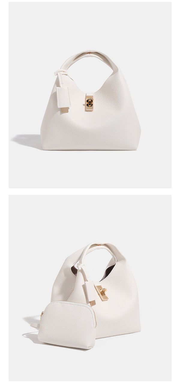Structured pebbled leather-look bucket tote with gold-tone turn-lock hardware and looped top handle, detail view 8