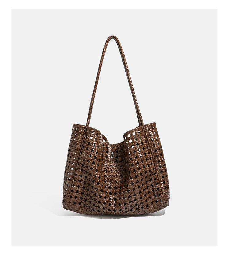 Slouchy open-lattice woven shoulder tote bag with long braided straps and matching zip pouch, detail view 13