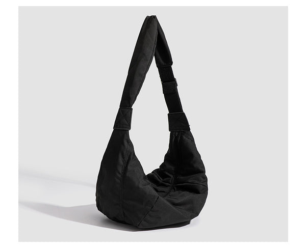 Large crescent sling shoulder bag in gathered fabric with zip closure and adjustable strap, detail view 13