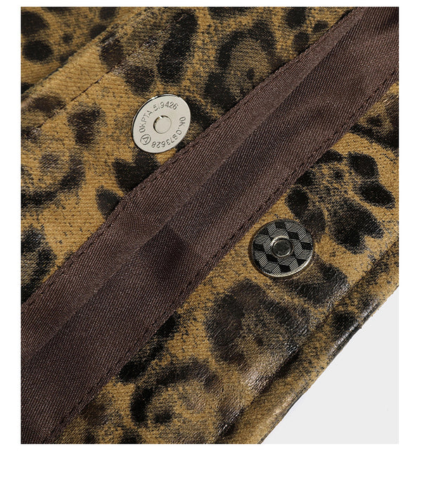 Large leopard print shoulder tote bag in tan and brown with slim dark straps and dangling beaded charm hardware, detail view