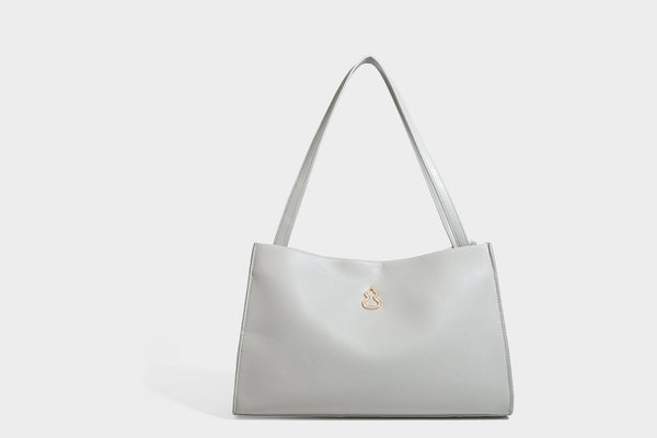 Structured rectangular shoulder tote bag with smooth leather-look finish, long double straps, and gold-tone gourd emblem on