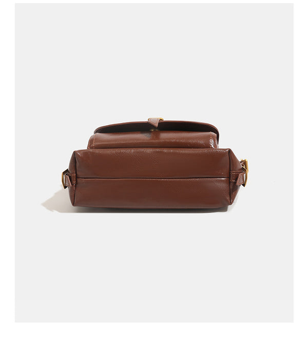 Compact glossy oil-wax leather-look shoulder bag with front buckle flap pocket and gold-tone hardware, detail view 14