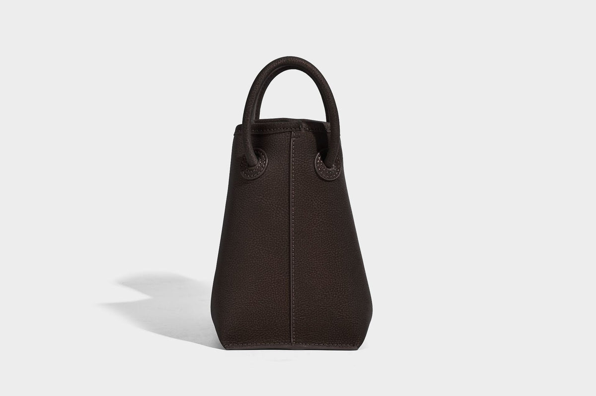 Small structured matte pebbled tote bag with twin top handles and removable zip pouch, detail view 19