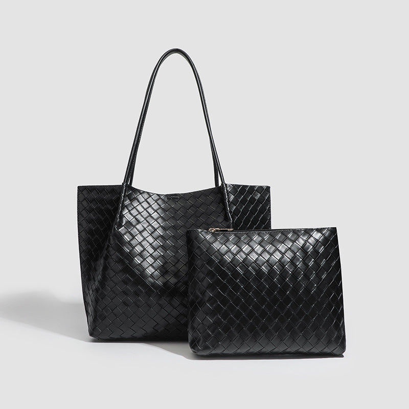 Large black woven leather-look tote bag with twin shoulder straps and matching inner pouch, detail view 2