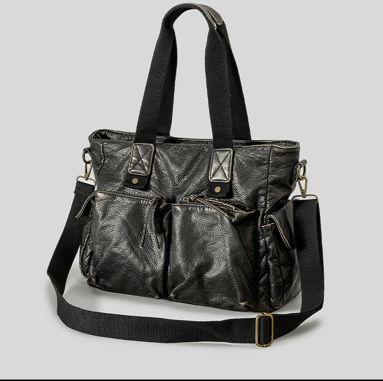 Slouchy crinkled pebbled leather-look convertible tote bag in gunmetal black with woven top handles, adjustable shoulder