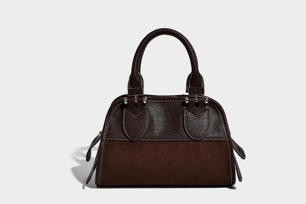 Kleine strukturierte Satchel-Tasche mit abgerundeten Henkeln, kontrastierenden weißen Steppnähten, Steckverschluss in Silberoptik und abnehmbarem