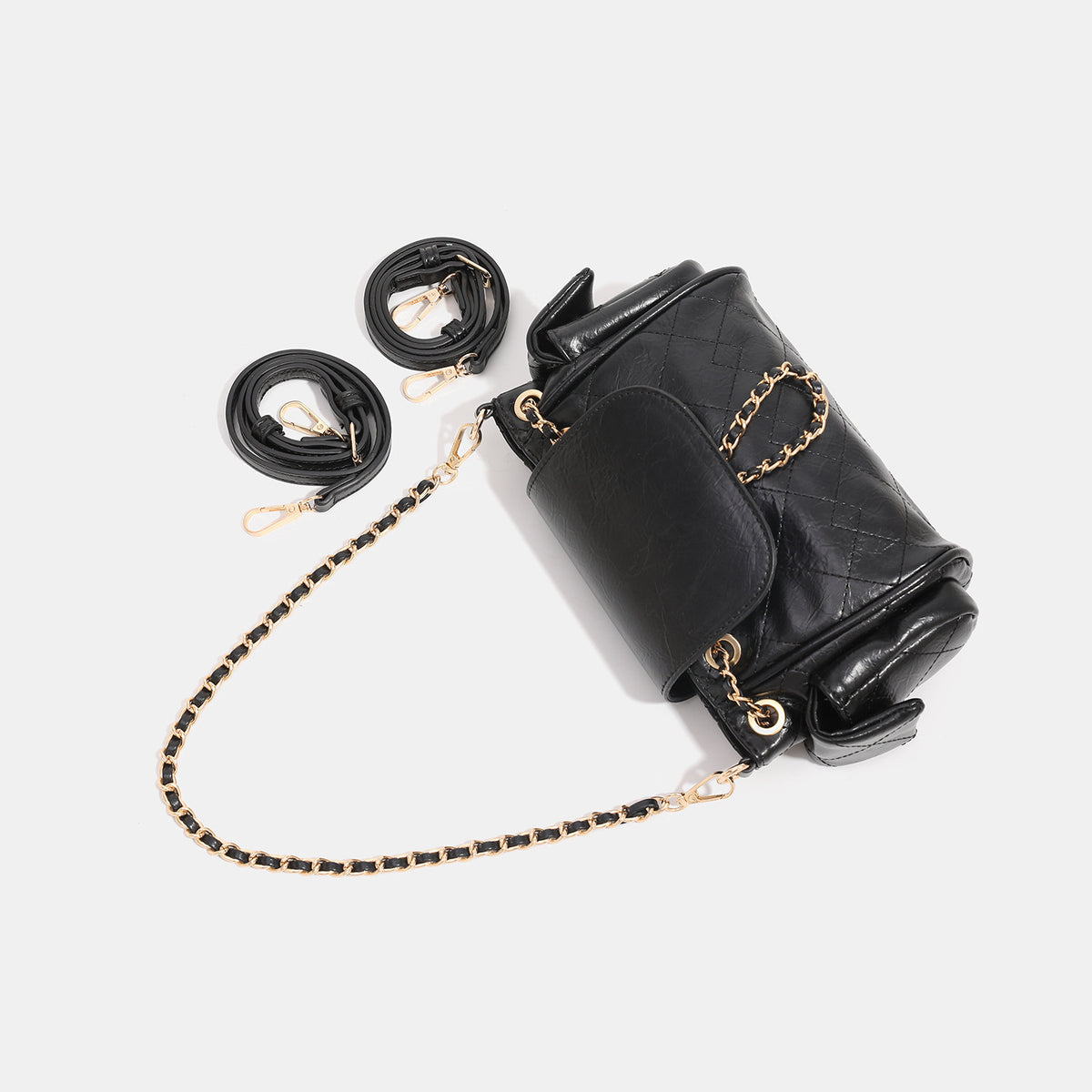 Small quilted leather-look flap bag with gold-tone chain strap and diamond stitch pattern, detail view 4