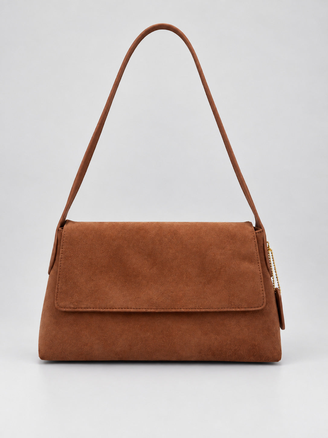 Rectangular matte suede-finish flap shoulder bag with slim dark strap and gold-tone turn-lock hardware, detail view 7