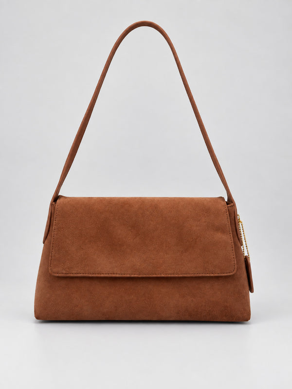Rectangular matte suede-finish flap shoulder bag with slim dark strap and gold-tone turn-lock hardware, detail view 7