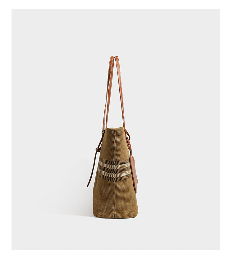 Large structured plaid check tote bag with smooth tan leather-look shoulder straps, attached front zip pouch, and gold-tone
