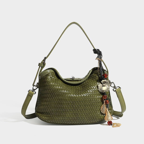 Small woven-look leather-look flap shoulder hobo bag in burgundy with silver-tone hardware and decorative tassel charm