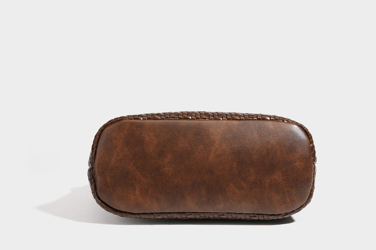 Woven leather-look tote bag in mocha brown with knotted top handle, front flap pocket, and detachable crossbody strap with