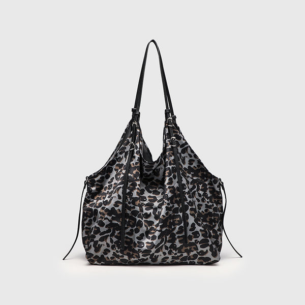 Large leopard-print slouchy tote shoulder bag in grey, black, and tan with gold-tone hardware and adjustable leather-look