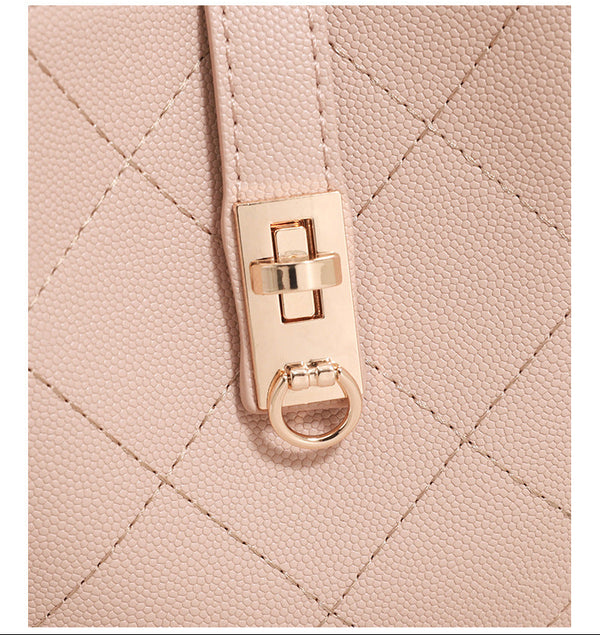 Mini diamond-quilted pebbled-finish bucket bag with gold-tone turn-lock closure and top handle, detail view 14