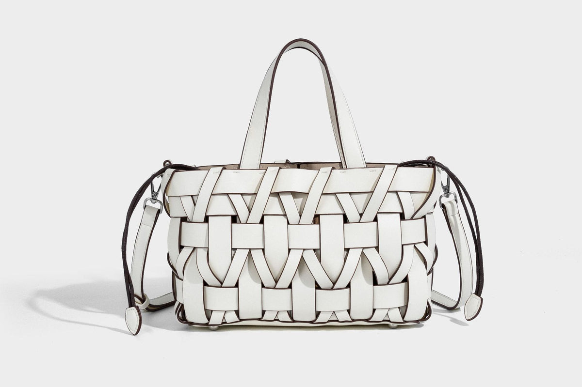 Structured woven basket tote handbag with contrasting dark trim, double top handles, detachable shoulder strap, and