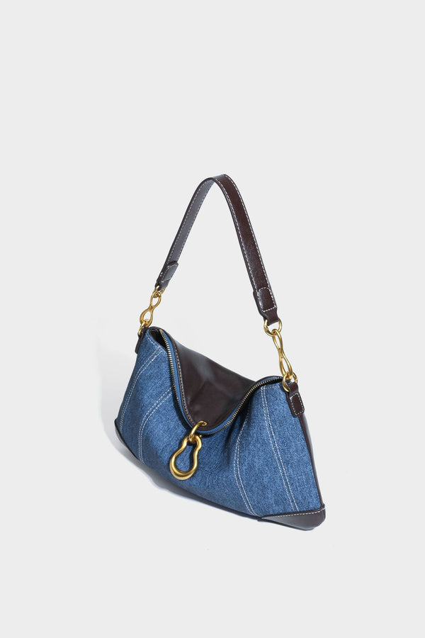 Slouchy denim shoulder bag with dark leather-look trim, gold-tone chain-link hardware, and top zipper closure, detail view 30