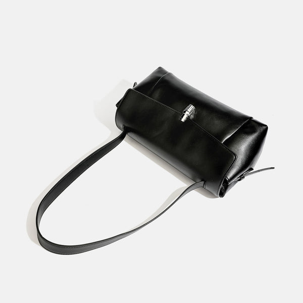 Structured rectangular flap shoulder bag with smooth leather-look finish, silver-tone turn-lock clasp, and long slim