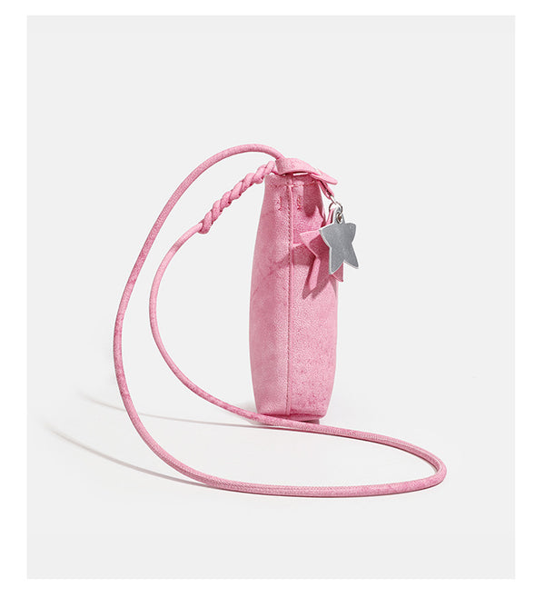 Small vertical textured mini crossbody phone bag with long braided cord strap and silver-toned star charm, detail view 12