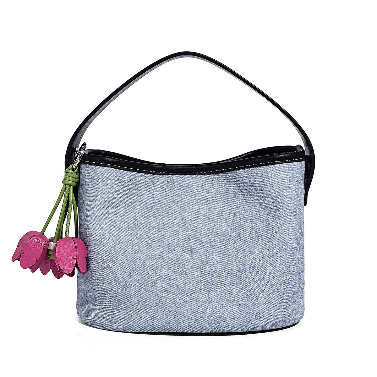 Small denim-look bucket bag with black leather-look trim, pink tulip flower charm, and adjustable crossbody strap, detail