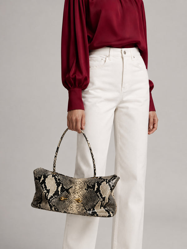 Wide embossed-texture shoulder tote bag with single loop handle and gold-tone toggle hardware, detail view 13