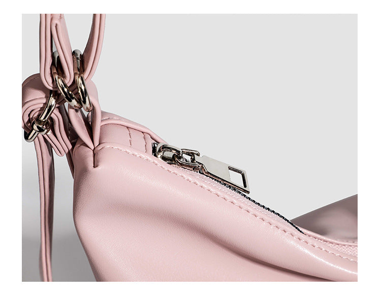 Glossy leather-look hobo shoulder bag with front bow lacing detail and silver-tone chain strap, detail view 13