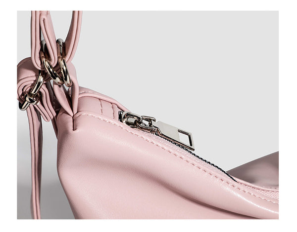 Glossy leather-look hobo shoulder bag with front bow lacing detail and silver-tone chain strap, detail view 13