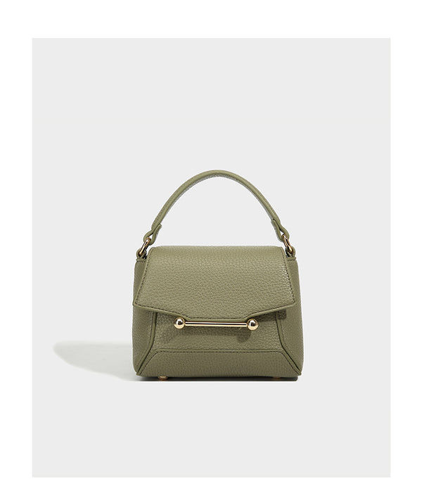Small structured pebbled flap mini satchel with gold-tone bar hardware, short top handle, and detachable crossbody strap