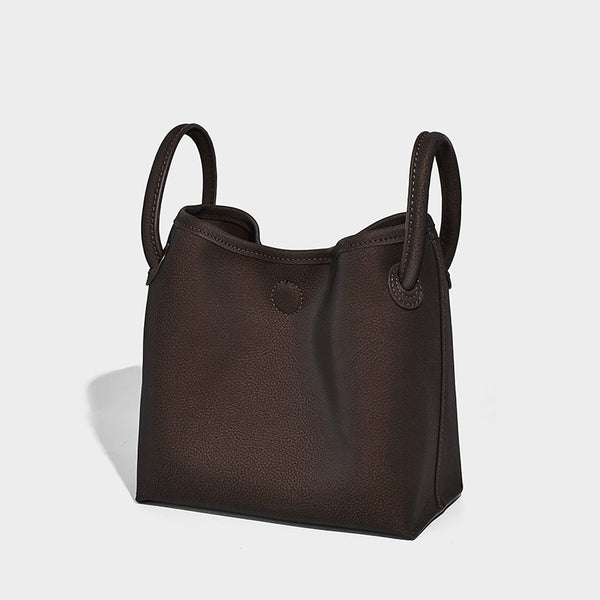 Small structured matte pebbled tote bag with twin top handles and removable zip pouch, detail view 7