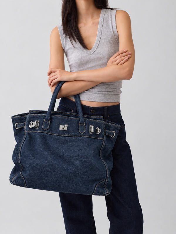 Large structured tote bag with turn-lock closure, silver-tone buckle hardware, and twin rolled handles, detail view 13