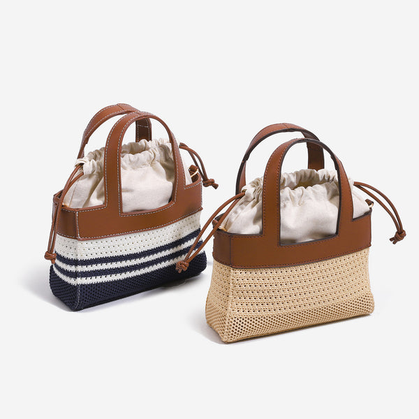 Small woven open-weave bucket bag with brown leather-look trim, cream gathered drawstring lining, dual top handles, and
