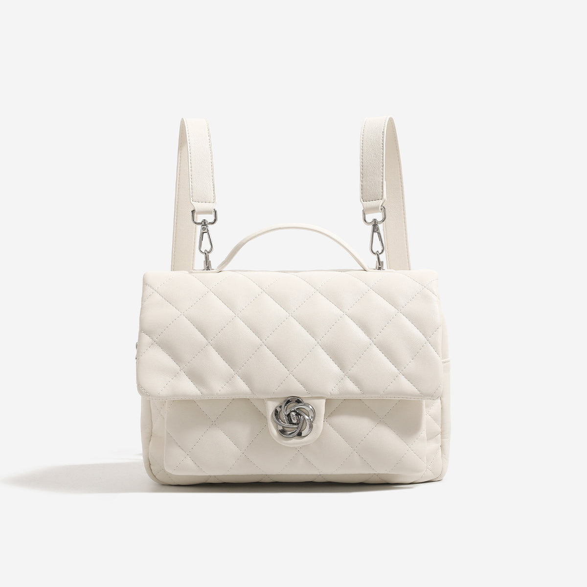 Diamond-quilted flap backpack handbag with silver-tone flower turn-lock, top handle, and dual shoulder straps, detail view 7