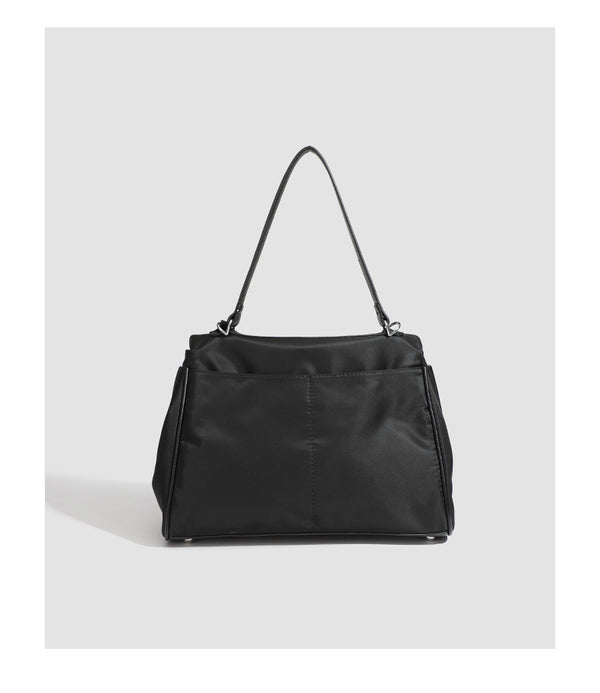 Structured black leather-look flap satchel bag with silver turn-lock hardware and top handle, detail view 29