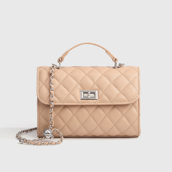 Small structured diamond-quilted flap satchel bag with silver-tone chain strap and turn-lock closure, detail view 9