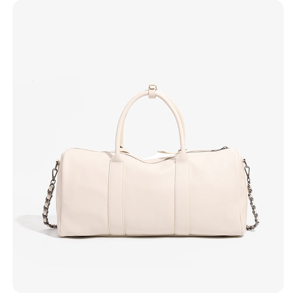 Large cream white pebbled leather-look barrel travel bag with twin top handles, chunky chain shoulder strap, front zip