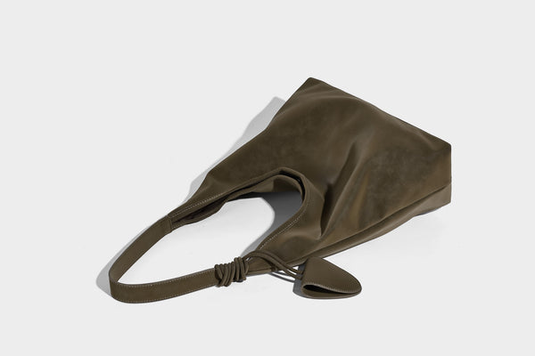 Slouchy oversized matte suede-look shoulder tote bag with knotted strap and attached front flap pouch, detail view 14